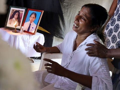 The mother of Shaini, 13, who died as bomb blasts ripped through churches and luxury hotels on Easter, mourns at her wake, in Negombo, Sri Lanka, on Monday, April 22, 2019.