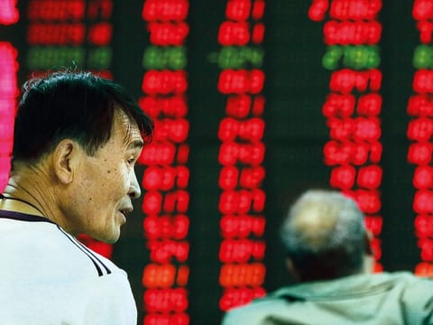 How aversion to losses influences money-making mentality among stock investors. Investors monitor stock prices at a brokerage in Beijing.