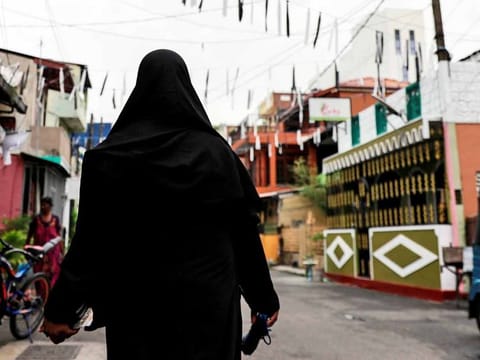 A Muslim woman walks through a street near St Anthony's Shrine, days after a string of suicide bomb attacks across the island on Easter Sunday, in Colombo, Sri Lanka, April 29, 2019.