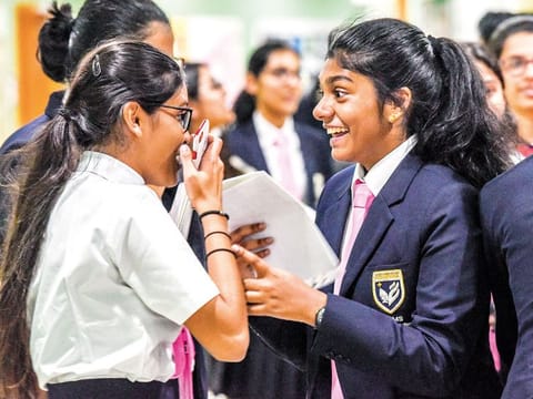 Disha Baldawa, left, and Anumita Anand, during the result of the ICSE at the GEMS Modern Academy, Dubai.