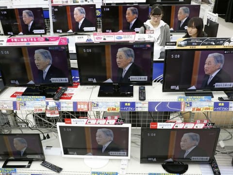 TV screens show news program reporting on Emperor Akihito's abdication, at an electrical appliance store in Urayasu, near Tokyo Tuesday, April 30, 2019.