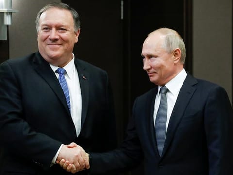Russian President Vladimir Putin and US Secretary of State Mike Pompeo shake hands before talks in the Black Sea resort city of Sochi, Russia, May 14, 2019.