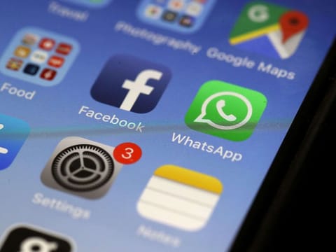 The WhatsApp messaging app is displayed on an Apple iPhone.