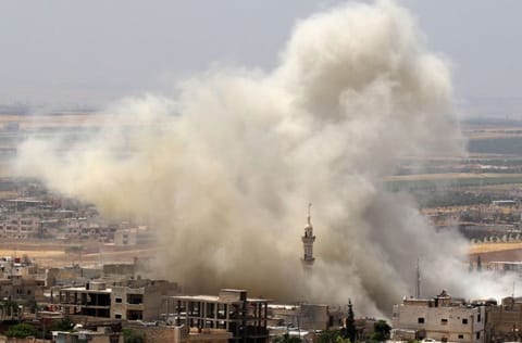 Smoke plumes billowing after reported air strikes on the town of Khan Sheikhun in the southern countryside of the rebel-held Idlib province on June 3, 2019.