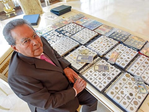 Parshotam Mukhi showing his collection of rare coins and currency notes at his home in Dubai.