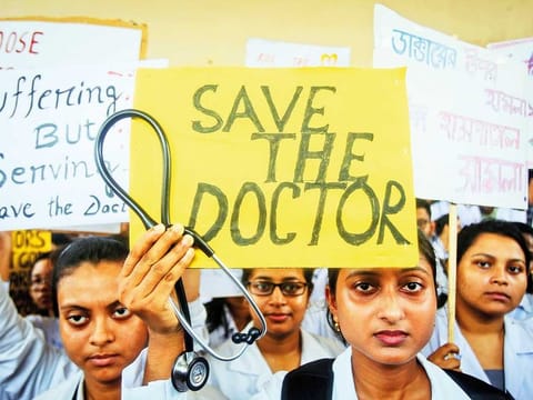 File picture: A doctor holds a placard at a government hospital during a strike demanding security after the recent assaults on doctors by the patients' relatives, in Agartala, India.