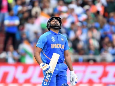 India's Rohit Sharma walks back to the pavilion after his dismissal.