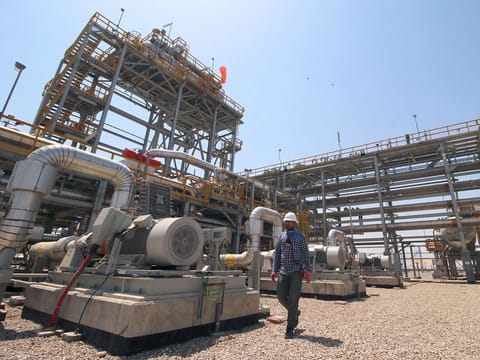 A staff of the West Qurna-1 oilfield, which is operated by ExxonMobil, is seen at the West Qurna-1 oilfield, Iraq.