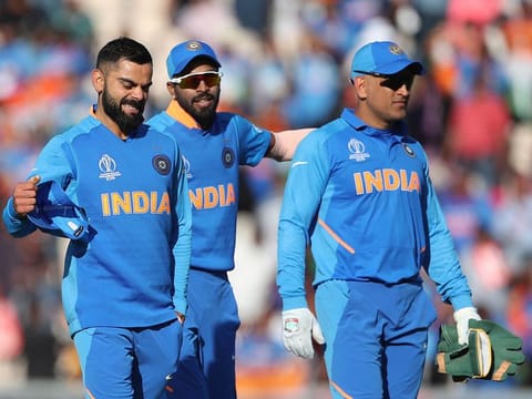 India's captain Virat Kohli, left, celebrates their win as he leaves the field with teammates at the end of the match against Afghanistan at the Hampshire Bowl in Southampton, on Saturday, June 22, 2019.