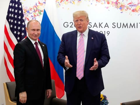 President Donald Trump, right, and Russian President Vladimir Putin pose for a photo during a bilateral meeting on the sidelines of the G-20 summit in Osaka, Japan, Friday, June 28, 2019.