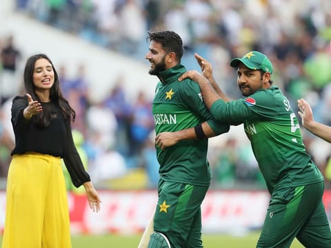 Pakistan's Imad Wasim is congratulated by Pakistan's captain Sarfaraz Ahmad, second right, after their win against Afghanistan at Headingley in Leeds.