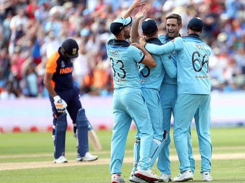 England's Chris Woakes, second right, celebrates with teammates the dismissal of India's Rohit Sharma, during the match at Edgbaston in Birmingham.