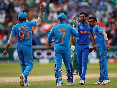 India's Bhuvneshwar Kumar celebrates with team mates after taking the wicket of Bangladesh's Mashrafe Mortaza