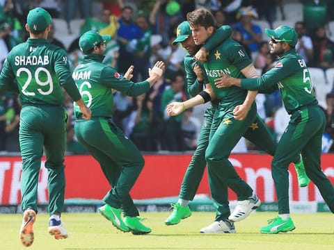 Pakistan's Shaheen Shah Afridi (2R) celebrates with teammates after the dismissal of Afghanistan's Hashmatullah Shahidi during their group stage match at Headingley in Leeds, on June 29, 2019.