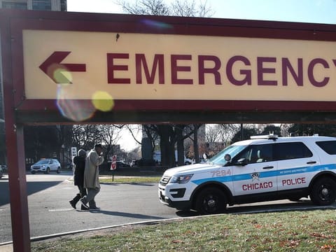 A police vehicle sits outside of a hospital in Chicago, Illinois