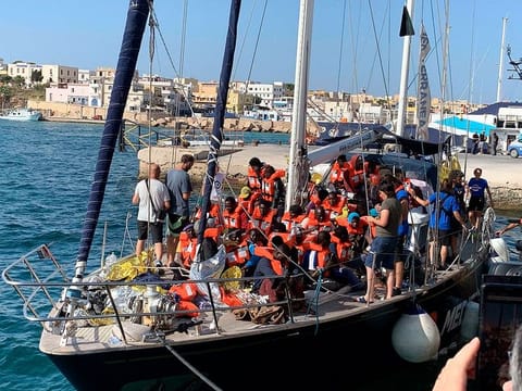 The Italian NGO Mediterranea Saving Humans' Alex migrant rescue ship carrying 46 migrants rescued off Libya coasts, docks in the port of Lampedusa, Sicily island, Italy, Saturday, July 6, 2019.