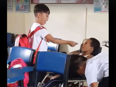 Viral video shows determined children taking care of each other.