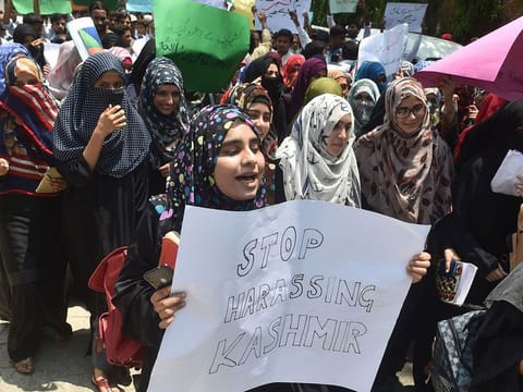 Pakistani students chant slogans during an anti-Indian protest rally in Lahore on August 5, 2019, as they denounce the ongoing unrest situation in Indian administered Kashmir.