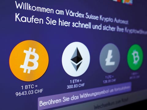 Exchange rates and logos of Bitcoin (BTH), Ether (ETH), Litecoin (LTC) and Bitcoin Cash (BCH) are seen on the display of a cryptocurrency ATM in Zurich. Picture used for illustrative purposes.