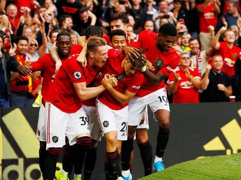 Manchester United's Daniel James celebrates scoring their fourth goal with Scott McTominay, Marcus Rashford and team mates.