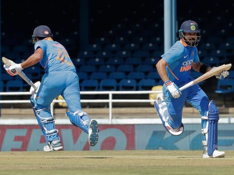 India captain Virat Kohli, right, and Rohit Sharma, run between the wickets during their second One-Day International cricket match against West Indies in Port of Spain, Trinidad, on August 11, 2019.
