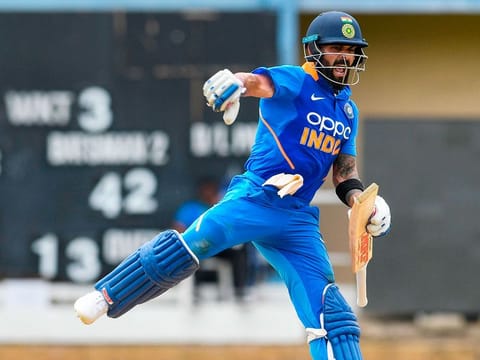 India skipper Virat Kohli celebrates his century during the 2nd ODI match against West Indies at Queens Park Oval in Port of Spain, Trinidad and Tobago, on August 11, 2019.