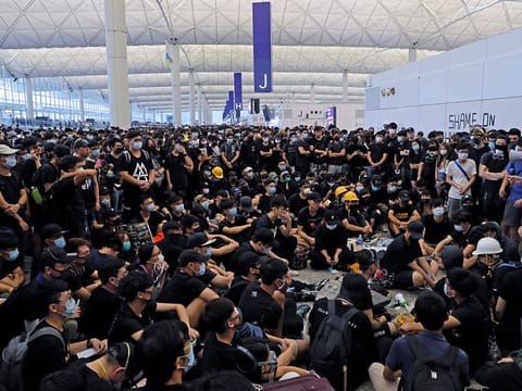 Illustrative picture from August 12: Protesters gather near an information board during a protest at the Hong Kong International Airport, Monday, Aug. 12, 2019.