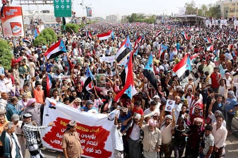 Yemeni Southern Transitional Council supporters wave flags of the former South Yemen (The People's Democratic Republic of Yemen) as they demonstrate in the Khormaksar district of Yemen's second city of Aden on August 15, 2019.