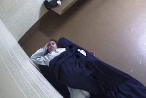 This photo from surveillance video released to Killmer, Lane & Newman, LLP law firm by the Denver City Jail shows Diana Sanchez, an inmate about to give birth alone in her Denver jail cell.