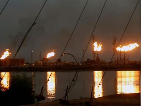 Flames emerge from flare stacks at Nahr Bin Umar oil field, north of Basra, Iraq September 16, 2019.