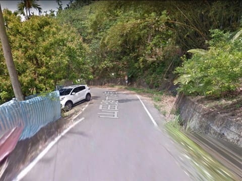 Couple at the side of a road in Taiwan.