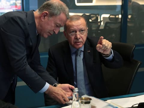 Turkish President Tayyip Erdogan is seen with Defence Minister Hulusi Akar at the operation center in Ankara, Turkey, October 9, 2019.