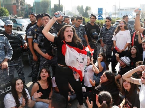 A university student gestures during an anti-government protest in Beirut, Lebanon, November 6, 2019.