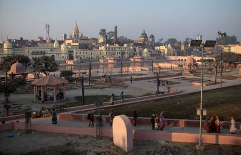 Hindu devotees leave after praying on the banks of Sarayu river after Supreme Court's verdict on a disputed religious site, in Ayodhya, India, November 11, 2019
