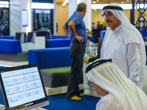 Trading floor of Dubai Financial Market. Most UAE investors are altering their investment portfolios ahead of the upcoming US election, placing their bets on stocks in the region to outperform over the next six months.