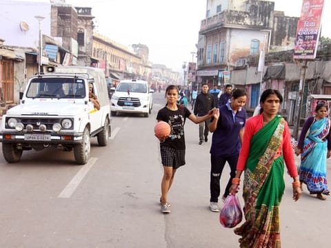 People walking on the road during the tight security setup at Hanuman Garhi in Ayodhya on Saturday. A five-judge bench of the Supreme Court delivered the verdict in Ayodhya land case
