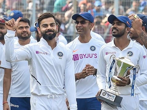 Indian captain Virat Kohli gives a thumbs up to cheering fans after winning the day-night Test series against Bangladesh, at Eden Gardens in Kolkata, on November 24, 2019.