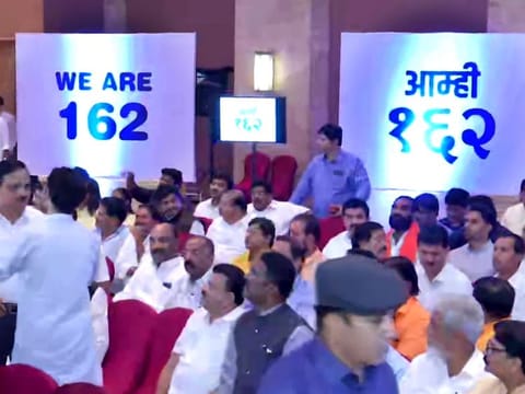 A graphic showing 'We Are 162' is seen during a meeting of Shiv Sena-NCP-Congress leaders with MLAs at Hotel Grand Hyatt in Mumbai on Monday