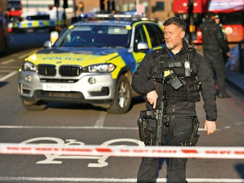 Police at the scene of an incident on London Bridge in central London following a police incident, Friday, Nov. 29, 2019. British police said Friday they were dealing with an incident on London Bridge, and witnesses have reported hearing gunshots. The Metropolitan Police force tweeted that officers were “in the early stages of dealing with an incident at London Bridge.