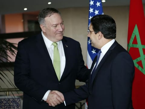Secretary of State Mike Pompeo shakes hands with Moroccan Foreign Minister Nasser Bourita, as they meet the media before a private meeting at the Foreign Minestry in Rabat, Morocco, Thursday, Dec. 5, 2019.
