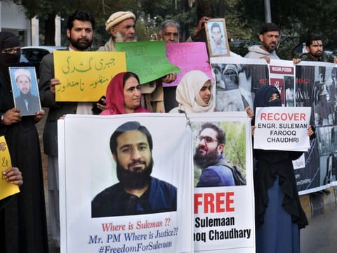 Pakistani families hold pictures of their missing family members during a demonstration to mark World Human Rights Day in Islamabad, Pakistan, Tuesday, Dec. 10, 2019.
Dozens of Pakistanis whose relatives were allegedly detained by security agencies in recent years Tuesday urged prime minister Imran Khan Khan to immediately order the release of their loved ones, as activists observed Human Rights Day across the country. (AP Photo/A.H. Chaudary)