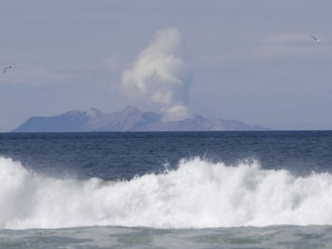 Plumes of steam rise above White Island off the coast of Whakatane, New Zealand, Thursday, Dec. 12, 2019.