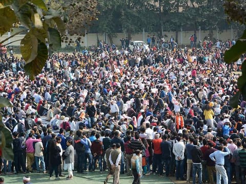 People assemble for a peaceful protest against the Citizenship Amendment Bill despite curfew, in Guwahati, Friday, Dec. 13, 2019