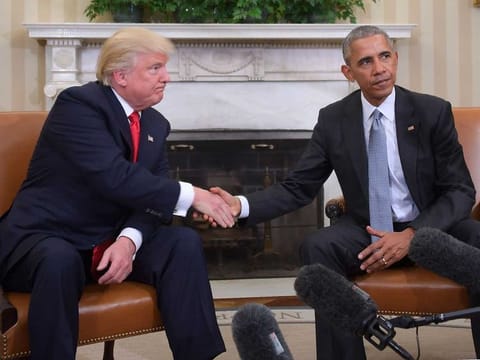 In this file photo taken on November 10, 2016, US President Barack Obama and President-elect Donald Trump shake hands during a transition planning meeting in the Oval Office at the White House in Washington, DC.