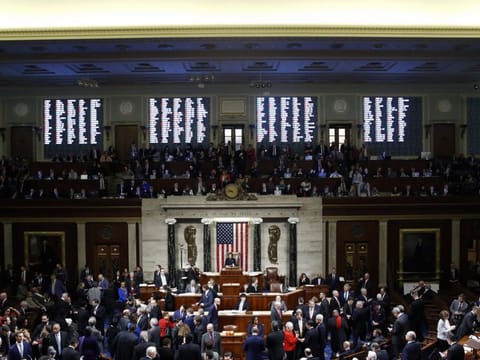 US House Speaker Nancy Pelosi stands on the dais as House members vote on impeachment against President Donald Trump in the House Chamber in Washington, D.C., U.S., on December 18, 2019. The US House of Representatives impeached Trump on charges of abuse of power and obstructing Congress