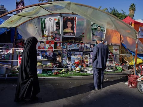 Posters of protesters who have been killed in demonstrations and their belongings are displayed in Tahrir Square during anti-government protests in Baghdad, Iraq, Thursday, Dec. 19, 2019.