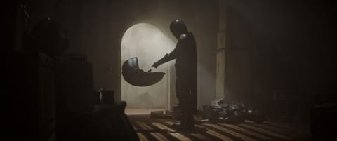 This undated image provided by Disney Plus shows a scene from "The Mandalorian." People can send each other animations of Baby Yoda again. Giphy, a database of the mini-videos, had been removing animated GIF files of the Star Wars character from the new Disney Plus streaming series “The Mandalorian.” (Disney Plus via AP)