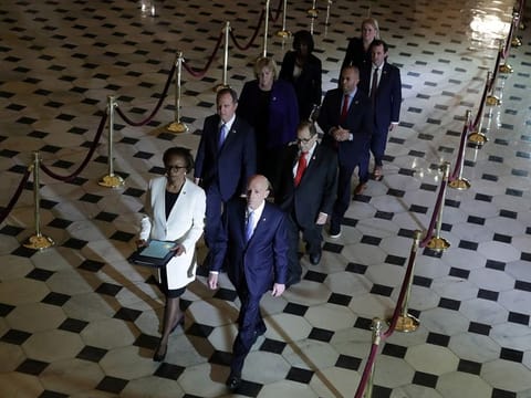 U.S. House of Representatives Clerk Cheryl Johnson and House Sergeant at Arms Paul Irving carry two articles of impeachment against U.S. President Donald Trump during a procession with the seven U.S. House impeachment managers through Statuary Hall in the U.S. Capitol in Washington, U.S. January 15, 2020.