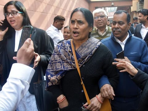 New Delhi, Jan 14 (ANI): Asha Devi, mother of 2012 Delhi gang-rape victim along with lawyer after Supreme Court dismissed the curative petitions filed by two of the four death row convicts in the 2012 Nirbhaya gangrape and murder case, in New Delhi on Tuesday. (ANI Photo)