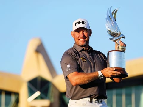 Lee Westwood holds aloft the Falcon Trophy at the Abu Dhabi Golf Course last year.